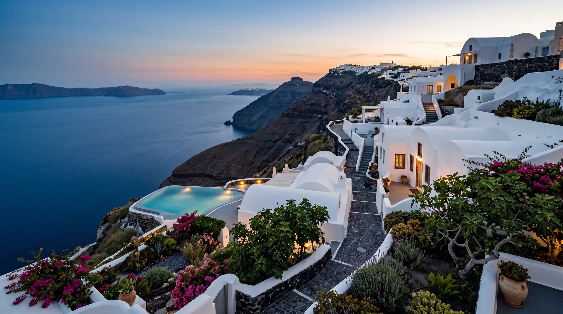 Cave suites and an infinity pool on the caldera cliff of Santorini
